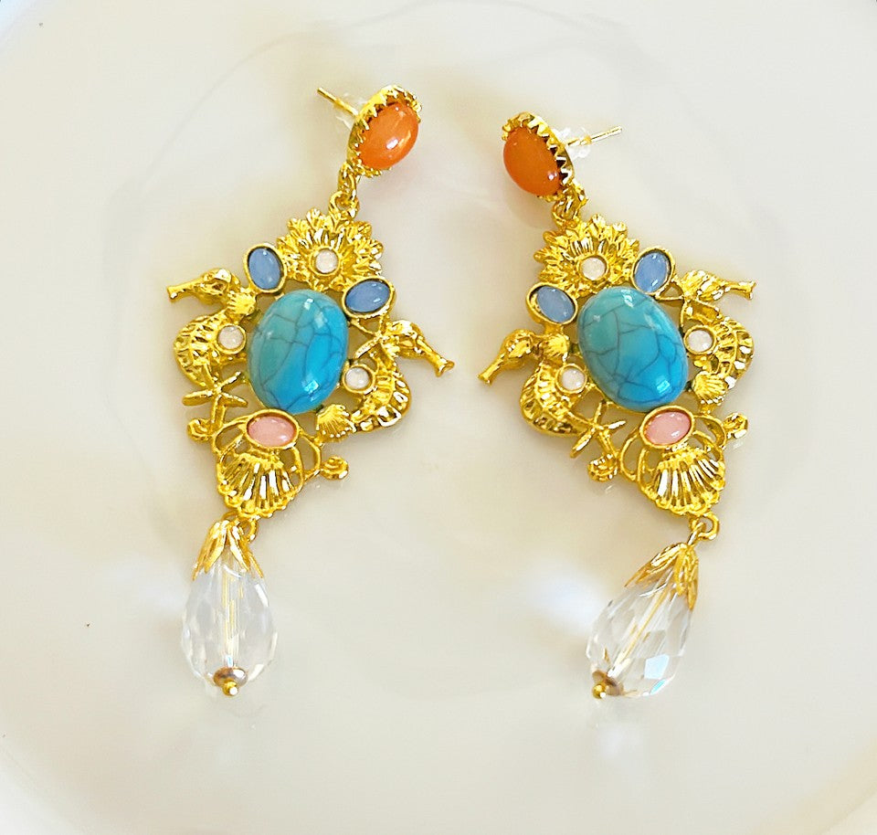 Large pierced statement earrings.