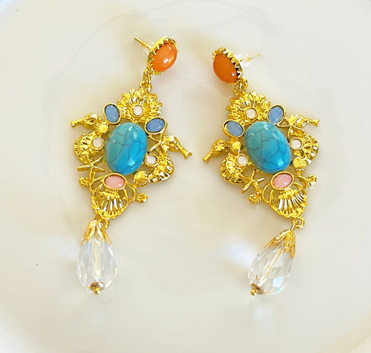 Large pierced statement earrings.