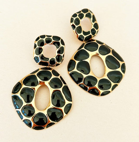 Large designer style statement pierced dangling earrings with black leopard spots.