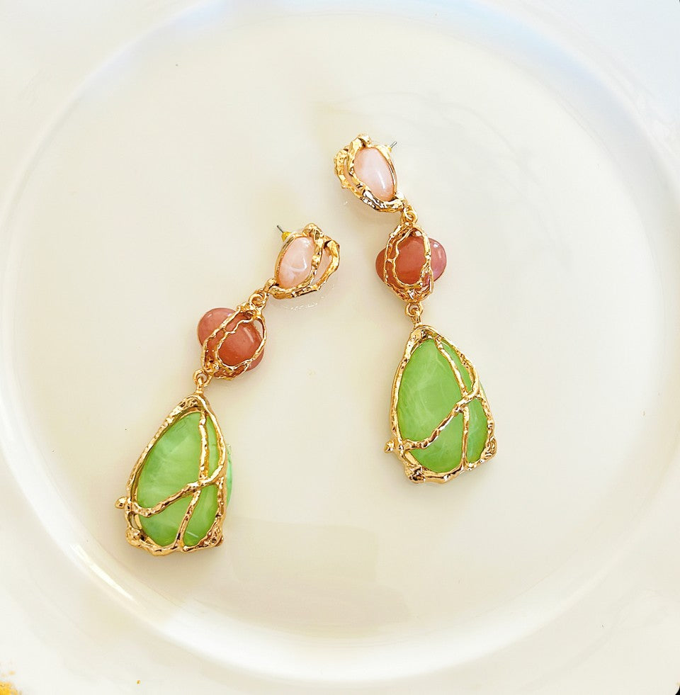 Larger statement pierced style earrings.