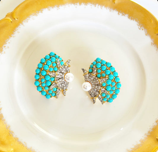 Large pierced shell style statement earrings.