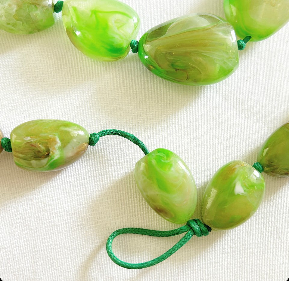 Super chunky acrylic stone style beads in a line green look