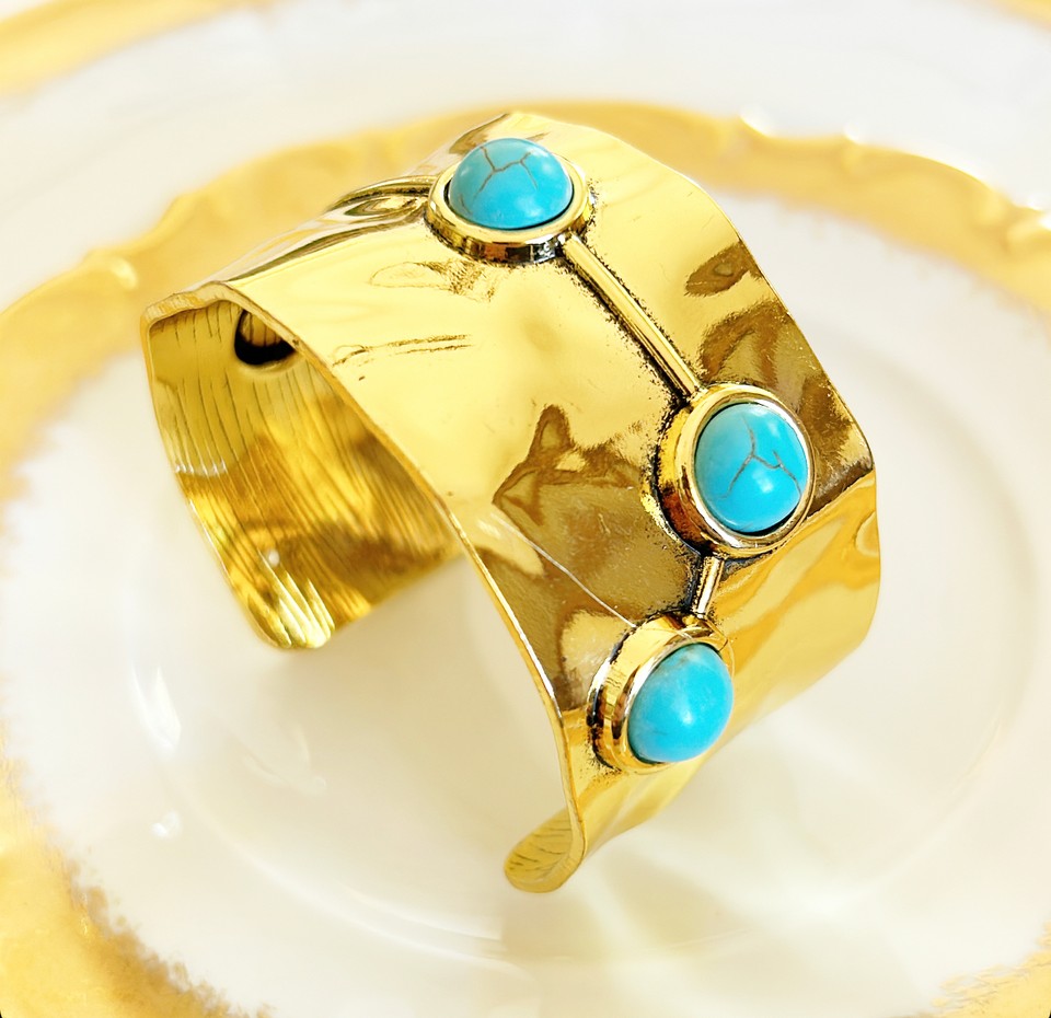 Chunky gold cuff statement bracelet.