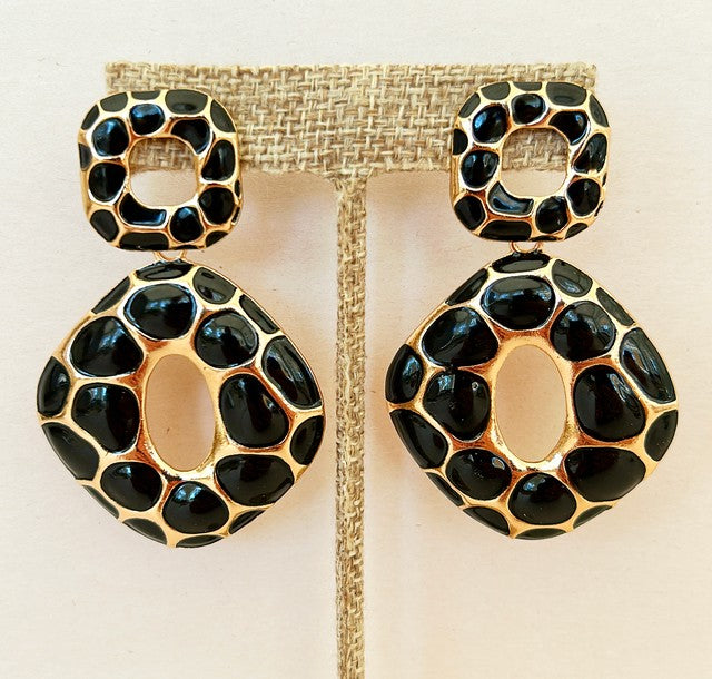 Large designer style statement pierced dangling earrings with black leopard spots.