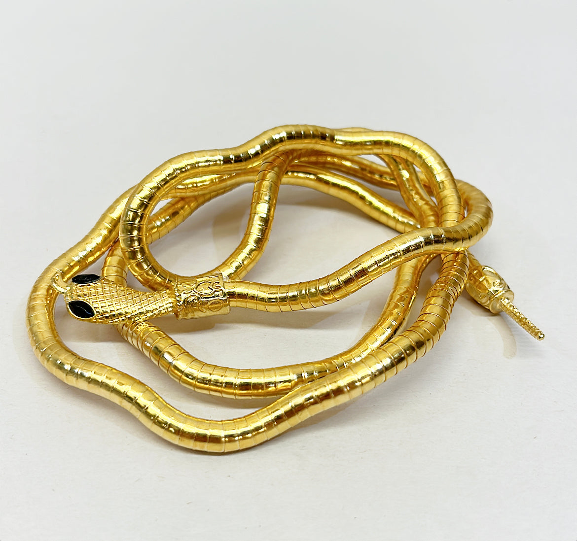 Gold metal flexible snake style necklace or bracelet.