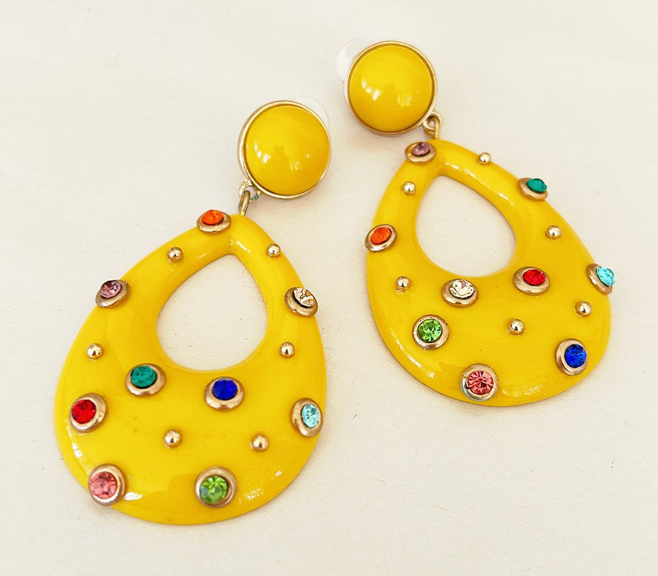 Extra large statement pierced earrings with a vintage 80s Valley Girl flare.